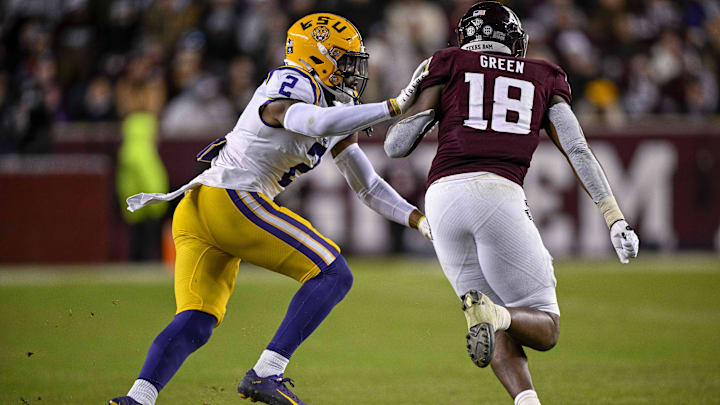 Nov 26, 2022; College Station, Texas, USA; LSU Tigers cornerback Mekhi Garner (2) and Texas A&M Aggies tight end Donovan Green (18) in action during the game between the Texas A&M Aggies and the LSU Tigers at Kyle Field. Mandatory Credit: Jerome Miron-Imagn Images
