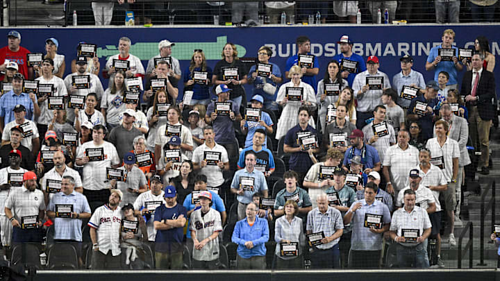 A view of the fans as they hold up Stand Up To Cancer placards during the game between the American League and the National League in the 2024 MLB All-Star game at Globe Life Field. A view of the fans as they hold up Stand Up To Cancer placards during the game between the American League and the National League in the 2024 MLB All-Star game at Globe Life Field.
