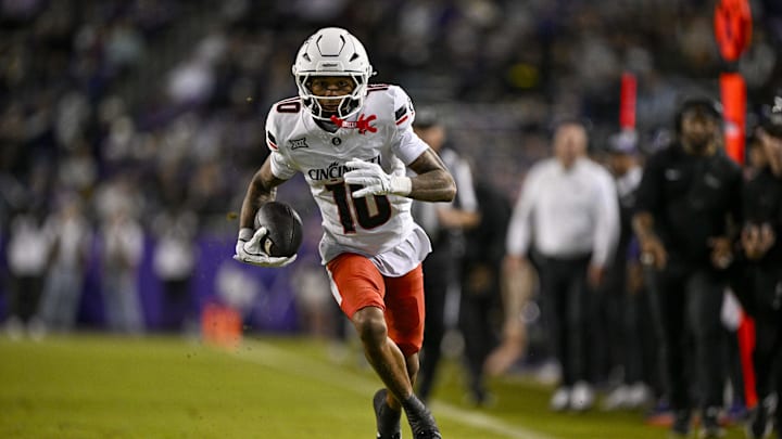 Nov 29, 2025; Fort Worth, Texas, USA; Cincinnati Bearcats wide receiver Caleb Goodie (10) catches the ball and runs for a first down against the TCU Horned Frogs during the first half at Amon G. Carter Stadium. Mandatory Credit: Jerome Miron-Imagn Images