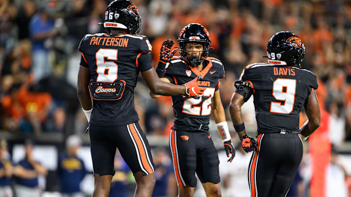 Aug 30, 2025; Corvallis, Oregon, USA; Oregon State Beavers defensive back Jalil Tucker (22) celebrates a defensive play with defensive back Jaheim Patterson (6) and linebacker Raesjon Davis (9) during the second half against the California Golden Bears at Reser Stadium. Mandatory Credit: Craig Strobeck-Imagn Images