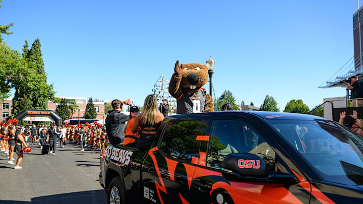 Sep 21, 2024; Corvallis, Oregon, USA; Oregon State Beavers mascot Benny leads the team arrival before a game against the Purdue Boilermakers at Reser Stadium. Mandatory Credit: Craig Strobeck-Imagn Images