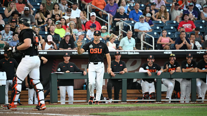 Jun 13, 2025; Omaha, Neb, USA; Oregon State Beavers head coach Mitch Canham calls time during the game against the Louisville Cardinals during the sixth inning at Charles Schwab Field. Mandatory Credit: Steven Branscombe-Imagn Images