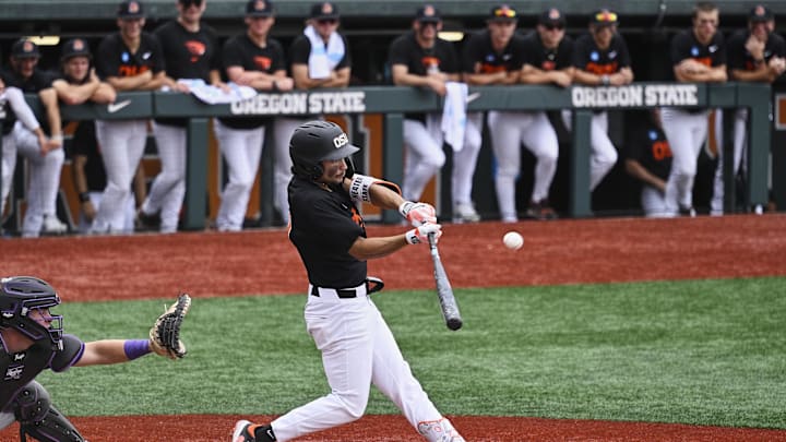 May 31, 2025; Corvallis, OR, USA; Oregon St. infielder AJ Singer (7) hits the ball in the seventh inning against TCU at the NCAA Corvallis Regional at Goss Stadium. Mandatory Credit: Troy Wayrynen-Imagn Images