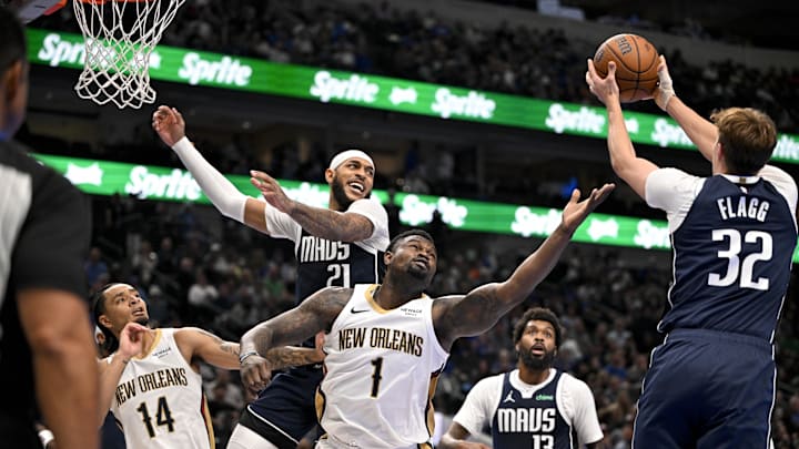 Nov 21, 2025; Dallas, Texas, USA; Dallas Mavericks forward Cooper Flagg (32) grabs a rebound in front of New Orleans Pelicans forward Zion Williamson (1) during the second quarter at the American Airlines Center. Mandatory Credit: Jerome Miron-Imagn Images Nov 21, 2025; Dallas, Texas, USA; Dallas Mavericks forward Cooper Flagg (32) grabs a rebound in front of New Orleans Pelicans forward Zion Williamson (1) during the second quarter at the American Airlines Center. Mandatory Credit: Jerome Miron-Imagn Images