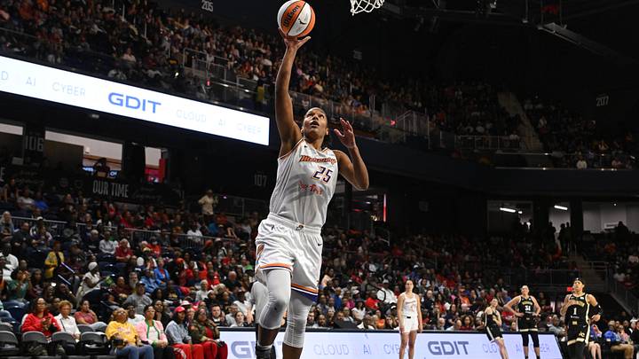 Sep 4, 2025; Washington, District of Columbia, USA;  Phoenix Mercury forward Alyssa Thomas (25) attempts a layup against the Washington Mystics during the second quarter at CareFirst Arena. Mandatory Credit: Rafael Suanes-Imagn Images
