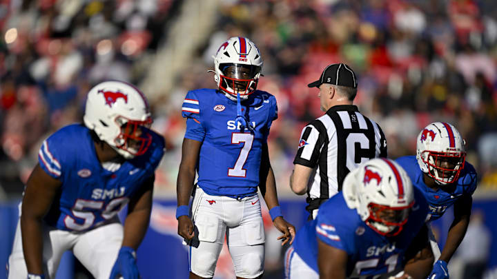 Nov 30, 2024; Dallas, Texas, USA; Southern Methodist Mustangs quarterback Kevin Jennings (7) in action during the game between the SMU Mustangs and the California Golden Bears at Gerald J. Ford Stadium. Mandatory Credit: Jerome Miron-Imagn Images