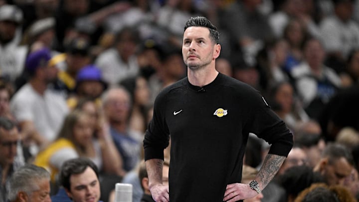 JJ Redick watches as his Lakers play the Mavericks.