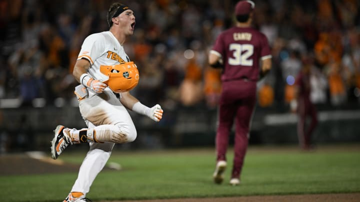 Jun 14, 2024; Omaha, NE, USA;  Tennessee Volunteers left fielder Dylan Dreiling (8) singles in the winning run against the Florida State Seminoles during the ninth inning at Charles Schwab Filed Omaha. Mandatory Credit: Steven Branscombe-USA TODAY Sports