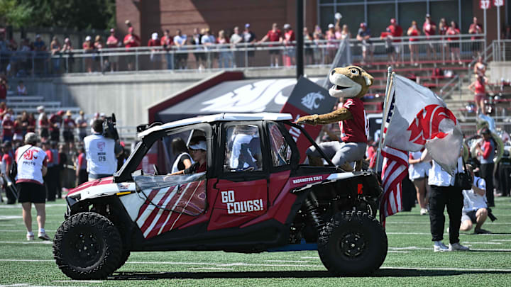 Aug 31, 2024; Pullman, Washington, USA; Washington State Cougars mascot Butch ride out on a ATV before a game against the Portland State Vikings at Gesa Field at Martin Stadium. Mandatory Credit: James Snook-USA TODAY Sports