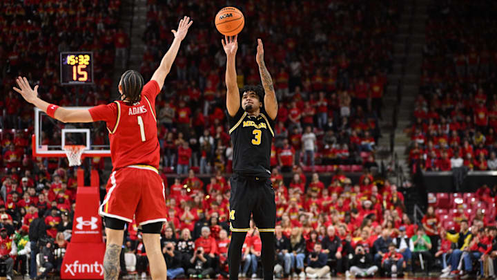 Dec 13, 2025; College Park, Maryland, USA; Michigan Wolverines guard Elliot Cadeau (3) hits a three-point basket in the first half over Maryland Terrapins guard Darius Adams (1) at Xfinity Center. Mandatory Credit: Jamie Sabau-Imagn Images Dec 13, 2025; College Park, Maryland, USA; Michigan Wolverines guard Elliot Cadeau (3) hits a three-point basket in the first half over Maryland Terrapins guard Darius Adams (1) at Xfinity Center. Mandatory Credit: Jamie Sabau-Imagn Images