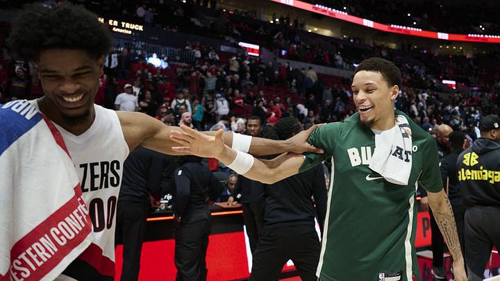 Mar 25, 2026; Portland, Oregon, USA; Portland Trail Blazers guard Scoot Henderson (00) and Milwaukee Bucks guard Ryan Rollins (13) talk after a game at Moda Center. Mandatory Credit: Troy Wayrynen-Imagn Images