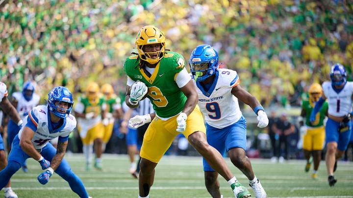 Sep 5, 2026; Eugene, Oregon, USA; Oregon Ducks tight end Jamari Johnson (9) catches a pass for a touchdown during the first half against Boise State Broncos safety Derek Ganter Jr. (9) at Autzen Stadium. Mandatory Credit: Troy Wayrynen-Imagn Images