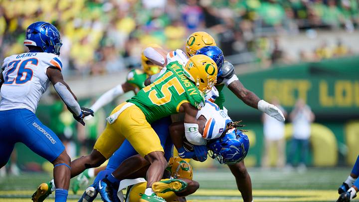 Sep 5, 2026; Eugene, Oregon, USA; Oregon Ducks defensive back Carl Williams IV (15) tackles Boise State Broncos running back Dylan Riley (0) during the second half at Autzen Stadium. Mandatory Credit: Troy Wayrynen-Imagn Images