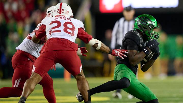 Oct 17, 2026; Eugene, Oregon, USA;  Oregon Ducks wide receiver Jalen Lott (10) catches a pass for a first down during the second half against Nebraska Cornhuskers defensive back Caleb Benning (28) at Autzen Stadium. Mandatory Credit: Troy Wayrynen-Imagn Images