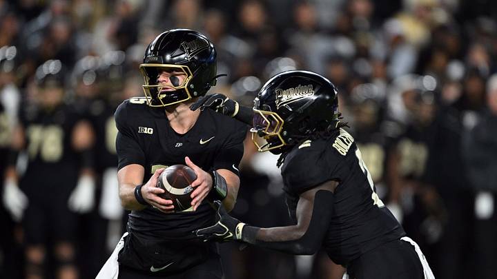 Oct 16, 2026; West Lafayette, Indiana, USA; Purdue Boilermakers quarterback Ryan Browne (15) hands the ball off to Purdue Boilermakers running back Fame Ijeboi (2) during the first quarter against the Washington Huskies at Ross-Ade Stadium. Mandatory Credit: Marc Lebryk-Imagn Images Oct 16, 2026; West Lafayette, Indiana, USA; Purdue Boilermakers quarterback Ryan Browne (15) hands the ball off to Purdue Boilermakers running back Fame Ijeboi (2) during the first quarter against the Washington Huskies at Ross-Ade Stadium. Mandatory Credit: Marc Lebryk-Imagn Images