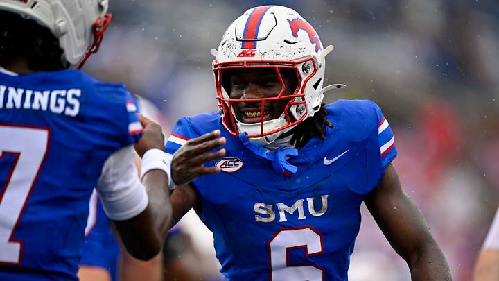 Oct 3, 2026; Dallas, Texas, USA; SMU Mustangs running back Kendrick Raphael (6) and quarterback Kevin Jennings (7) celebrate after Raphael scores a touchdown against the Boston College Eagles during the first half at Gerald J. Ford Stadium. Mandatory Credit: Jerome Miron-Imagn Images