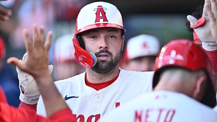 Jul 27, 2026; Anaheim, California, USA; Los Angeles Angels first baseman Nolan Schanuel (18) is greeted by teammates after hitting a sacrifice flyout to score a run during the first inning against the Houston Astros at Angel Stadium. Mandatory Credit: William Liang-Imagn Images