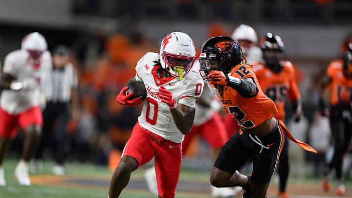 Sep 26, 2025; Corvallis, Oregon, USA; Houston Cougars wide receiver Amare Thomas (0) runs the ball during the fourth quarter against the Oregon State Beavers at Reser Stadium. Mandatory Credit: Craig Strobeck-Imagn Images