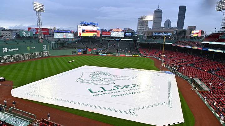 May 14, 2026; Boston, Massachusetts, USA; A general view of the field at Fenway Park covered during a rain delay before the start of a game between the Boston Red Sox and the Philadelphia Phillies. Mandatory Credit: Eric Canha-Imagn Images May 14, 2026; Boston, Massachusetts, USA; A general view of the field at Fenway Park covered during a rain delay before the start of a game between the Boston Red Sox and the Philadelphia Phillies. Mandatory Credit: Eric Canha-Imagn Images