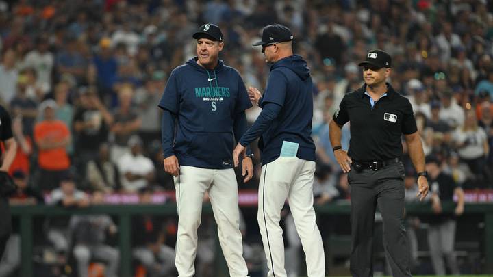 Aug 5, 2026; Seattle, Washington, USA; Seattle Mariners bench coach Manny Acta escorts manager Dan Wilson off the field after Wilson was ejected by umpire Mark Wegner during the eighth inning against the Detroit Tigers at T-Mobile Park. Mandatory Credit: Steven Bisig-Imagn Images
