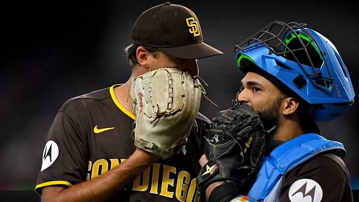 San Diego Padres relief pitcher Kyle Hart (68) and catcher Rodolfo Duran (48) come off the field during the sixth inning at Globe Life Field on June 21, 2026.