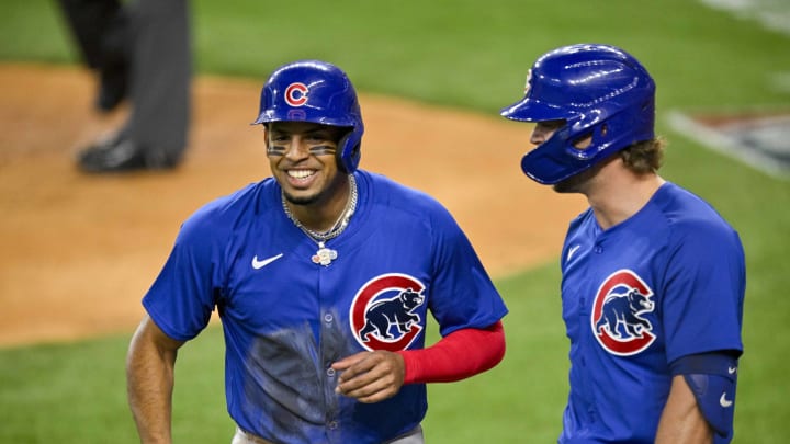 Mar 31, 2024; Arlington, Texas, USA; Chicago Cubs designated hitter Christopher Morel (5) and second baseman Nico Hoerner (2) celebrate after Morel scores against the Texas Rangers during the second inning at Globe Life Field. Mandatory Credit: Jerome Miron-USA TODAY Sports Mar 31, 2024; Arlington, Texas, USA; Chicago Cubs designated hitter Christopher Morel (5) and second baseman Nico Hoerner (2) celebrate after Morel scores against the Texas Rangers during the second inning at Globe Life Field. Mandatory Credit: Jerome Miron-USA TODAY Sports