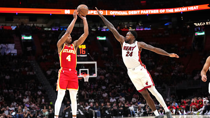 Oct 16, 2024; Miami, Florida, USA; Atlanta Hawks guard Kobe Bufkin (4) shoots the ball as Miami Heat forward Haywood Highsmith (24) defends in the second half at Kaseya Center. Mandatory Credit: Jim Rassol-Imagn Images Oct 16, 2024; Miami, Florida, USA; Atlanta Hawks guard Kobe Bufkin (4) shoots the ball as Miami Heat forward Haywood Highsmith (24) defends in the second half at Kaseya Center. Mandatory Credit: Jim Rassol-Imagn Images