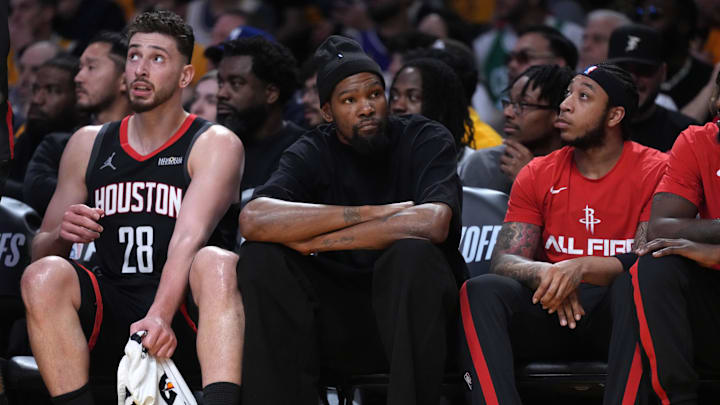 Apr 18, 2026; Los Angeles, California, USA; Houston Rockets center Alperen Sengun (28) and forward Kevin Durant (center) watch during the first half against the Los Angeles Lakers during game one of the first round of the 2026 NBA Playoffs at Crypto.com Arena. Mandatory Credit: Kirby Lee-Imagn Images