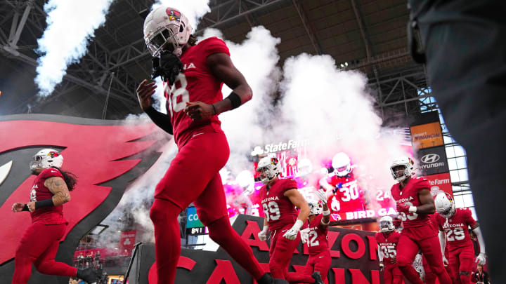 Cardinals wide out Marvin Harrison Jr (18) takes the field with his teammates prior to a game against the Saints at State Farm Stadium. Cardinals wide out Marvin Harrison Jr (18) takes the field with his teammates prior to a game against the Saints at State Farm Stadium.