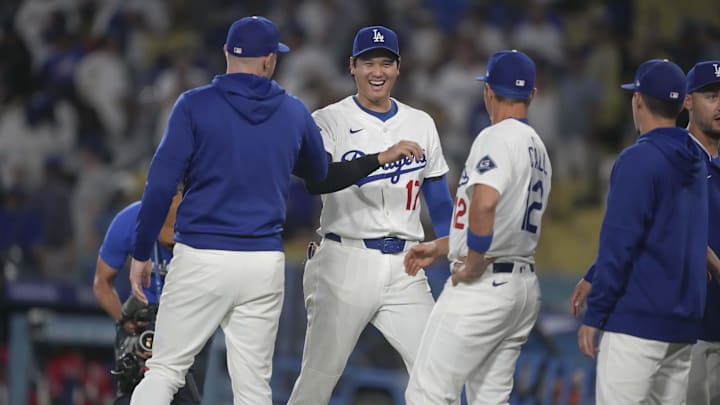 Aug 27, 2025; Los Angeles, California, USA; Los Angeles Dodgers starting pitcher Shohei Ohtani (17) is congratulated by outfielder Alex Call (12) on the win against the Cincinnati Reds at Dodger Stadium. Mandatory Credit: Kirby Lee-Imagn Images Aug 27, 2025; Los Angeles, California, USA; Los Angeles Dodgers starting pitcher Shohei Ohtani (17) is congratulated by outfielder Alex Call (12) on the win against the Cincinnati Reds at Dodger Stadium. Mandatory Credit: Kirby Lee-Imagn Images