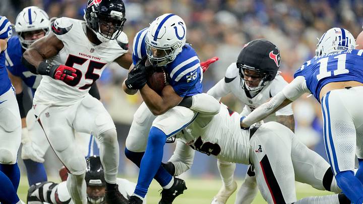 Indianapolis Colts running back Jonathan Taylor (28) works to rush past Houston Texans defensive tackle Denico Autry (96) on Sunday, Nov. 30, 2025, during a game against the Houston Texans at Lucas Oil Stadium in Indianapolis. Indianapolis Colts running back Jonathan Taylor (28) works to rush past Houston Texans defensive tackle Denico Autry (96) on Sunday, Nov. 30, 2025, during a game against the Houston Texans at Lucas Oil Stadium in Indianapolis.
