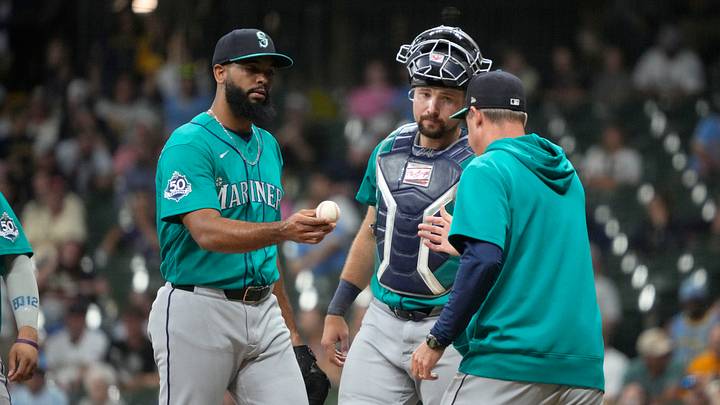 Aug 19, 2026; Milwaukee, Wisconsin, USA; Seattle Mariners pitcher Michael Rucker (38) is taken out of the game bymanager Dan Wilson (6) in the eighth inning against the Milwaukee Brewers in the eighth inning at American Family Field. Mandatory Credit: Michael McLoone-Imagn Images