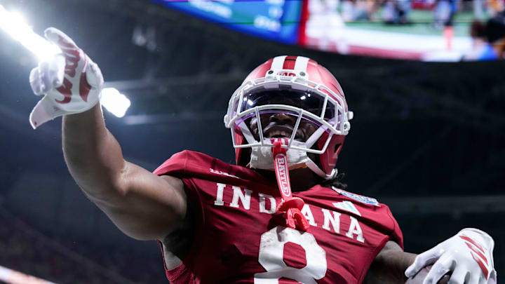 Indiana Hoosiers running back Kaelon Black (8) celebrates after rushing in a touchdown Friday, Jan. 9, 2026, during the Peach Bowl and semifinal game of the College Football Playoff against the Oregon Ducks at Mercedes-Benz Stadium in Atlanta.