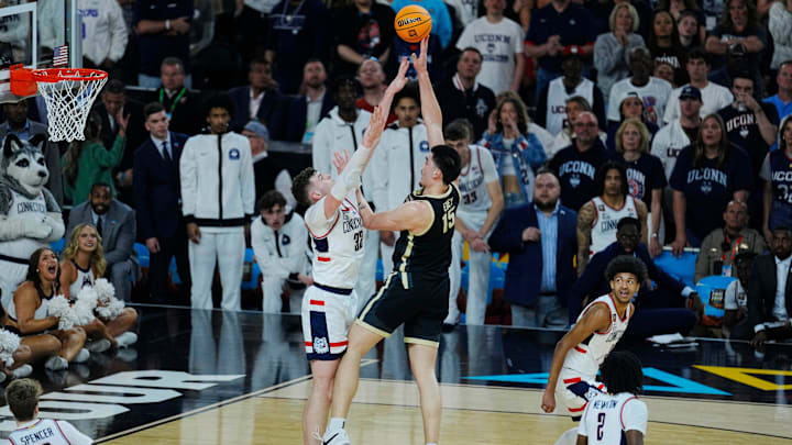Purdue Boilermakers center Zach Edey (15) shoots against Connecticut Huskies center Donovan Clingan (32) in the first half in the national championship game of the Final Four of the 2024 NCAA Tournament at State Farm Stadium in Glendale on April 8, 2024. Purdue Boilermakers center Zach Edey (15) shoots against Connecticut Huskies center Donovan Clingan (32) in the first half in the national championship game of the Final Four of the 2024 NCAA Tournament at State Farm Stadium in Glendale on April 8, 2024.