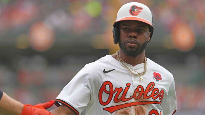 May 27, 2024; Baltimore, Maryland, USA; Baltimore Orioles outfielder Cedric Mullins (31) greeted after scoring in the fourth inning against the Boston Red Sox at Oriole Park at Camden Yards