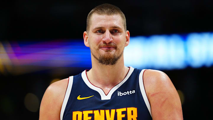 Dec 28, 2024; Denver, Colorado, USA; Denver Nuggets center Nikola Jokic (15) reacts in the fourth quarter against the Detroit Pistons at Ball Arena. Mandatory Credit: Ron Chenoy-Imagn Images