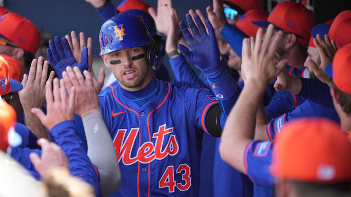 Feb 26, 2024; West Palm Beach, Florida, USA;  New York Mets left fielder Trayce Thompson (43) is congratulated by teammates after hitting a grand slam against the Washington Nationals in the third inning at CACTI Park of the Palm Beaches. Mandatory Credit: Jim Rassol-USA TODAY Sports