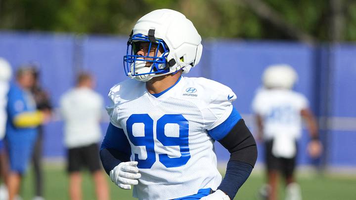 Aug 30, 2026; Woodland Hills, CA, USA; Los Angeles Rams defensive end Aaron Donald (99) wears a Guardian helmet cap at practice at the Rams Practice Facility.  Mandatory Credit: Kirby Lee-Imagn Images