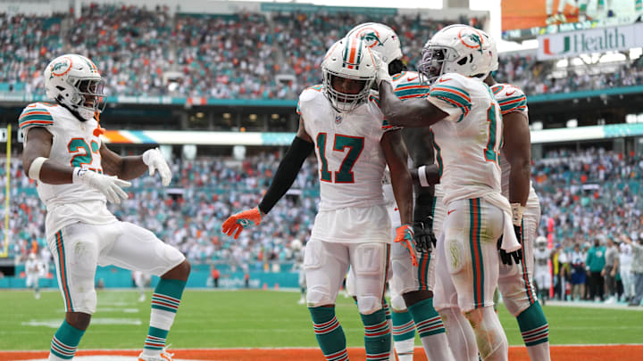 Miami Dolphins wide receiver Jaylen Waddle (17) waddles with teammates after scoring a touchdown