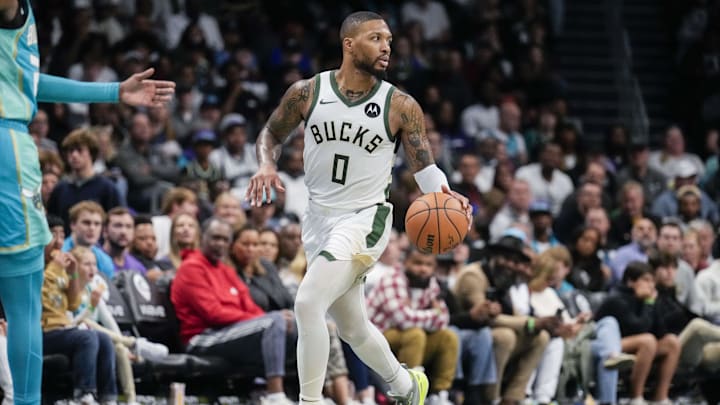 Nov 17, 2023; Charlotte, North Carolina, USA; Milwaukee Bucks guard Damian Lillard (0) brings the ball up court against the Charlotte Hornets during the second half at the Spectrum Center. Mandatory Credit: Jim Dedmon-Imagn Images