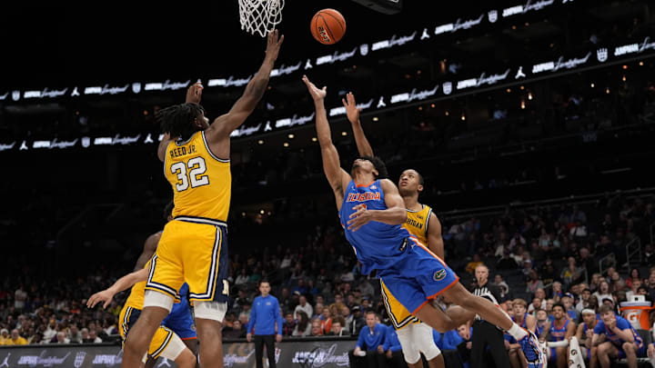 Dec 19, 2023; Charlotte, North Carolina, USA; Florida Gators guard Zyon Pullin (0) goes to the