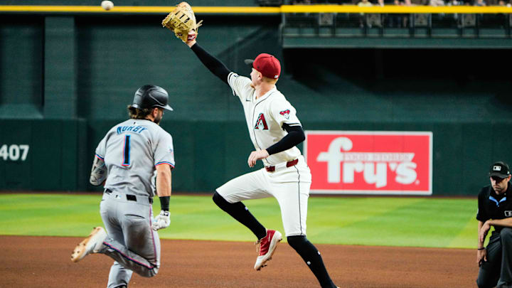 Jun 28, 2025; Phoenix, Arizona, USA; Arizona Diamondbacks first base Pavin Smith (26) get Miami Marlins third base Connor Norby (1) out during the seventh inning during a game between the Arizona Diamondbacks and the Miami Marlins at Chase Field. Mandatory Credit: Arianna Grainey-Imagn Images Jun 28, 2025; Phoenix, Arizona, USA; Arizona Diamondbacks first base Pavin Smith (26) get Miami Marlins third base Connor Norby (1) out during the seventh inning during a game between the Arizona Diamondbacks and the Miami Marlins at Chase Field. Mandatory Credit: Arianna Grainey-Imagn Images