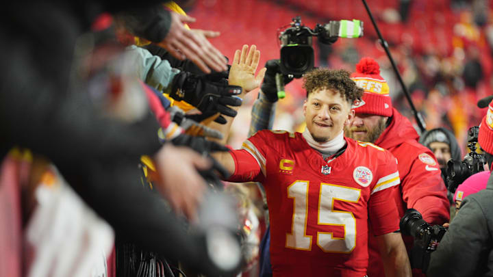 Kansas City Chiefs quarterback Patrick Mahomes (15) shakes hands with fans after defeating the Houston Texans in a 2025 AFC divisional round game at GEHA Field at Arrowhead Stadium. 
