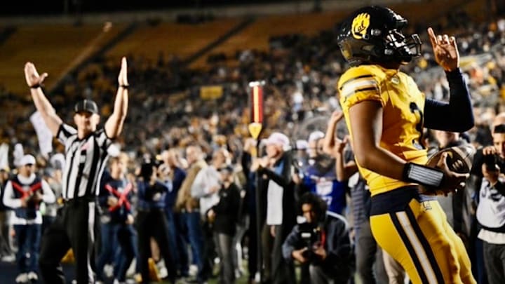 Jaron-Keawe Sagapolutele celebrates in the end zone Jaron-Keawe Sagapolutele celebrates in the end zone