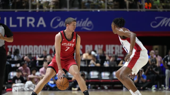 Jul 12, 2024; Las Vegas, NV, USA; Atlanta Hawks forward/guard Nikola Durisic (7) controls the ball against Washington Wizards guard Bub Carrington (17) during the first half at Thomas & Mack Center. Mandatory Credit: Lucas Peltier-USA TODAY Sports Jul 12, 2024; Las Vegas, NV, USA; Atlanta Hawks forward/guard Nikola Durisic (7) controls the ball against Washington Wizards guard Bub Carrington (17) during the first half at Thomas & Mack Center. Mandatory Credit: Lucas Peltier-USA TODAY Sports