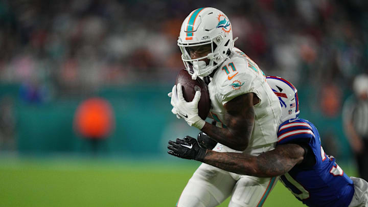 Miami Dolphins wide receiver Cedrick Wilson Jr. (11) catches a pass over Buffalo Bills cornerback Dane Jackson (30) during the first half at Hard Rock Stadium in the 2023 season finale.
