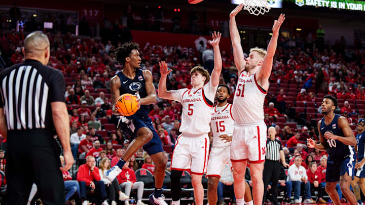 Nebraska forwards Braden Frager (5) and Rienk Mast (51) defend Penn State's Mason Blackwood during the second half at Pinnacle Bank Arena. Nebraska forwards Braden Frager (5) and Rienk Mast (51) defend Penn State's Mason Blackwood during the second half at Pinnacle Bank Arena.