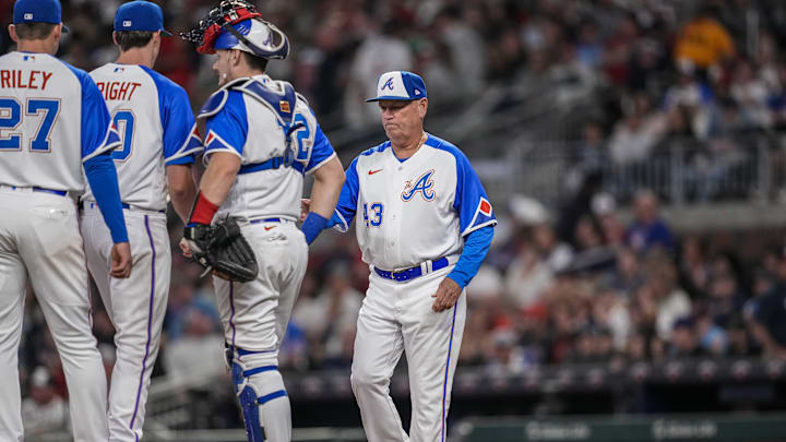 Apr 22, 2023; Cumberland, Georgia, USA; Atlanta Braves manager Brian Snitker (43) removes starting pitcher Kyle Wright (30) from the game against the Houston Astros during the sixth inning at Truist Park. Mandatory Credit: Dale Zanine-Imagn Images