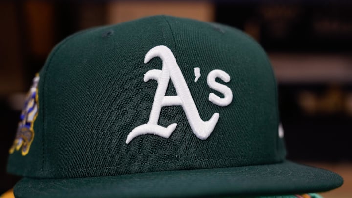 Apr 18, 2025; Milwaukee, Wisconsin, USA; General view of an Athletics hat during batting practice prior to the game against the Milwaukee Brewers at American Family Field. Mandatory Credit: Jeff Hanisch-Imagn Images Apr 18, 2025; Milwaukee, Wisconsin, USA; General view of an Athletics hat during batting practice prior to the game against the Milwaukee Brewers at American Family Field. Mandatory Credit: Jeff Hanisch-Imagn Images