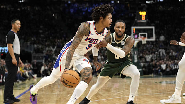 Oct 26, 2023; Milwaukee, Wisconsin, USA;  Philadelphia 76ers forward Kelly Oubre Jr. (9) drives for the basket against Milwaukee Bucks guard Damian Lillard (0) during the fourth quarter at Fiserv Forum. Mandatory Credit: Jeff Hanisch-Imagn Images